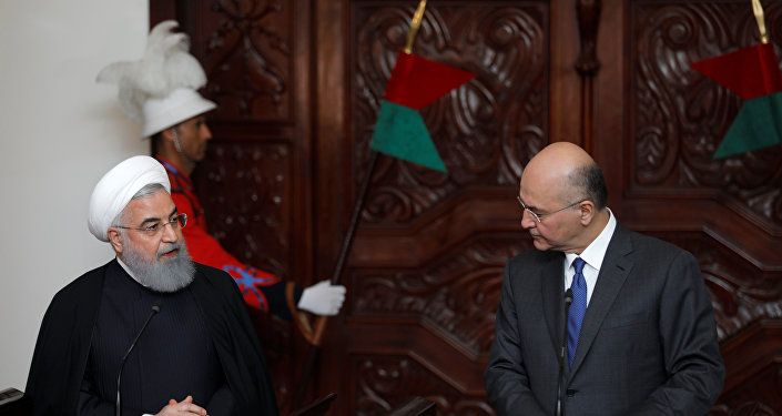 الرئيس العراقي برهم صالح في مؤتمر صحفي مع نظيره الإيراني حسن روحاني
