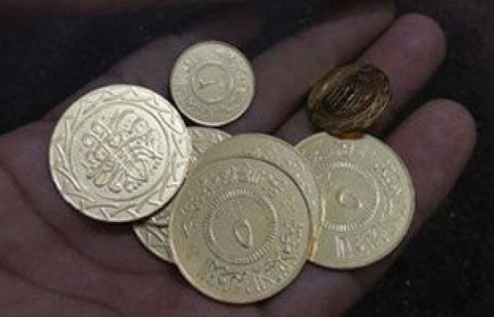 بالصور.. "داعش" يعمم عملات معدنية خاصة به فى الرقة السورية