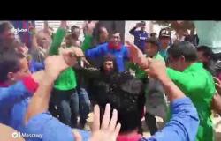 الاستفتاء|مواطنون يرقصون على نغمات "تسلم الأيادي"أمام اللجان بـ أكتوبر