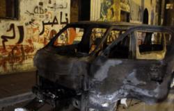 أنصار الإخوان يحرقون سيارة شرطة ويخربون واجهات المحلات فى أسيوط