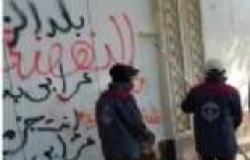 بالصور| "نظافة القاهرة" تزيل العبارات المسيئة للجيش والشرطة من محيط "الاتحادية"
